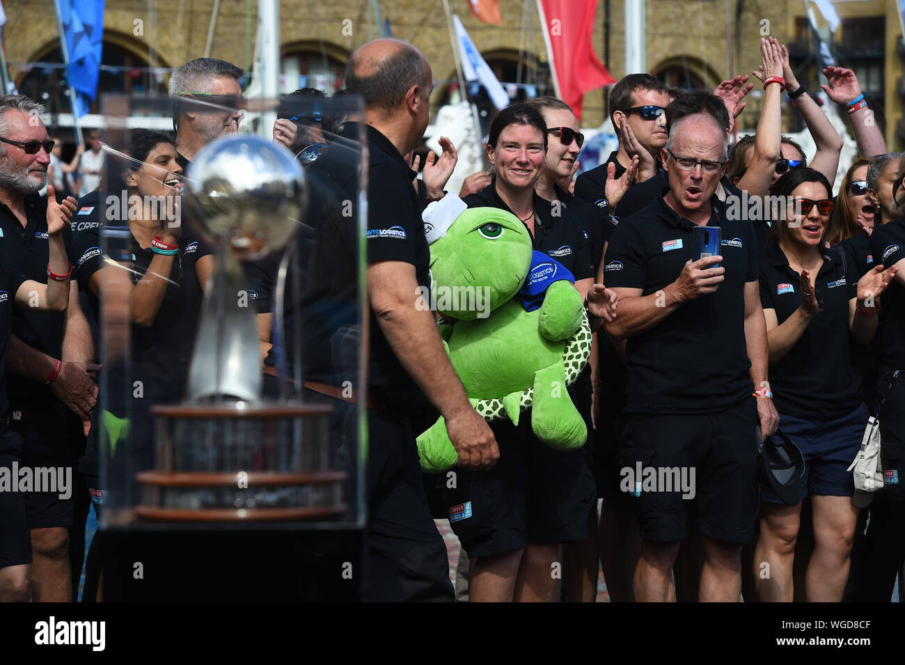 The Clipper Round the World Race trophy on display as WTC logistics wait to get on their boat, at the Departure Ceremony at St Katharine Docks Marina, by the river Thames in central London, before their departure down the river. Stock Photo