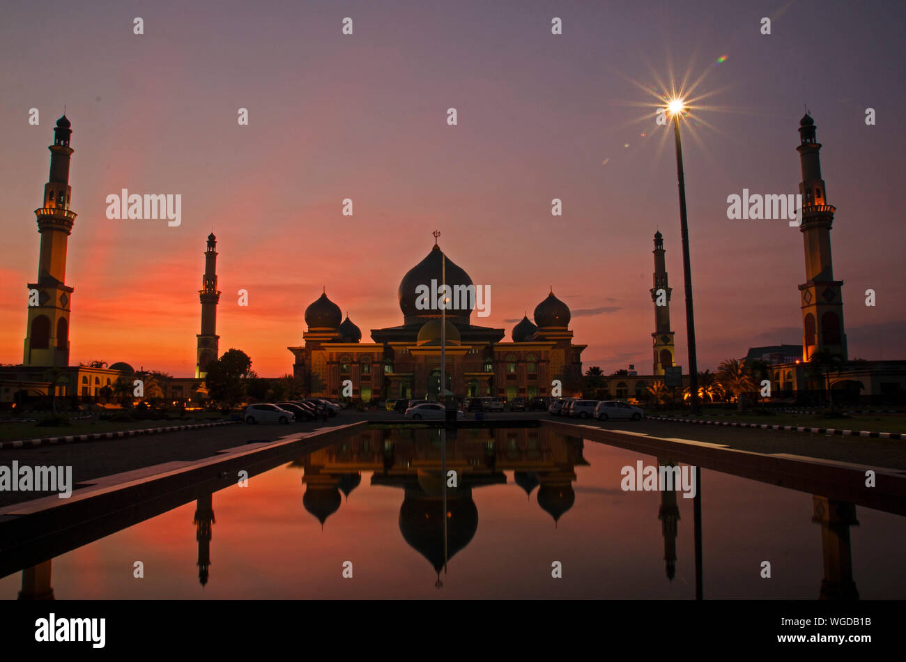 Facade Of An Nur Great Mosque Against Sky During Sunset Stock Photo