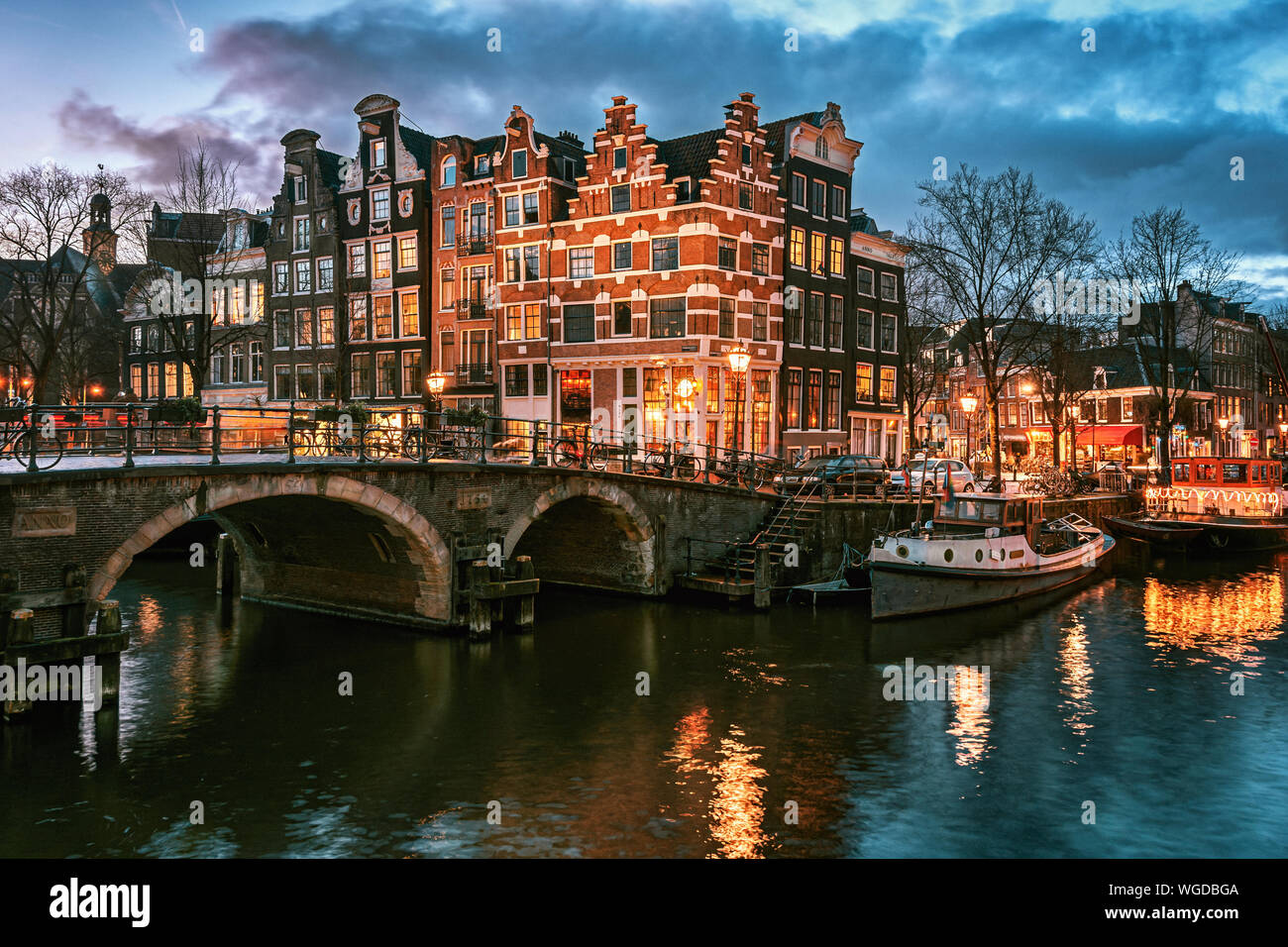Beautiful canal houses on the corner of Brouwersgracht and Prinsengracht in the old center of Amsterdam in The Netherlands during sunset Stock Photo
