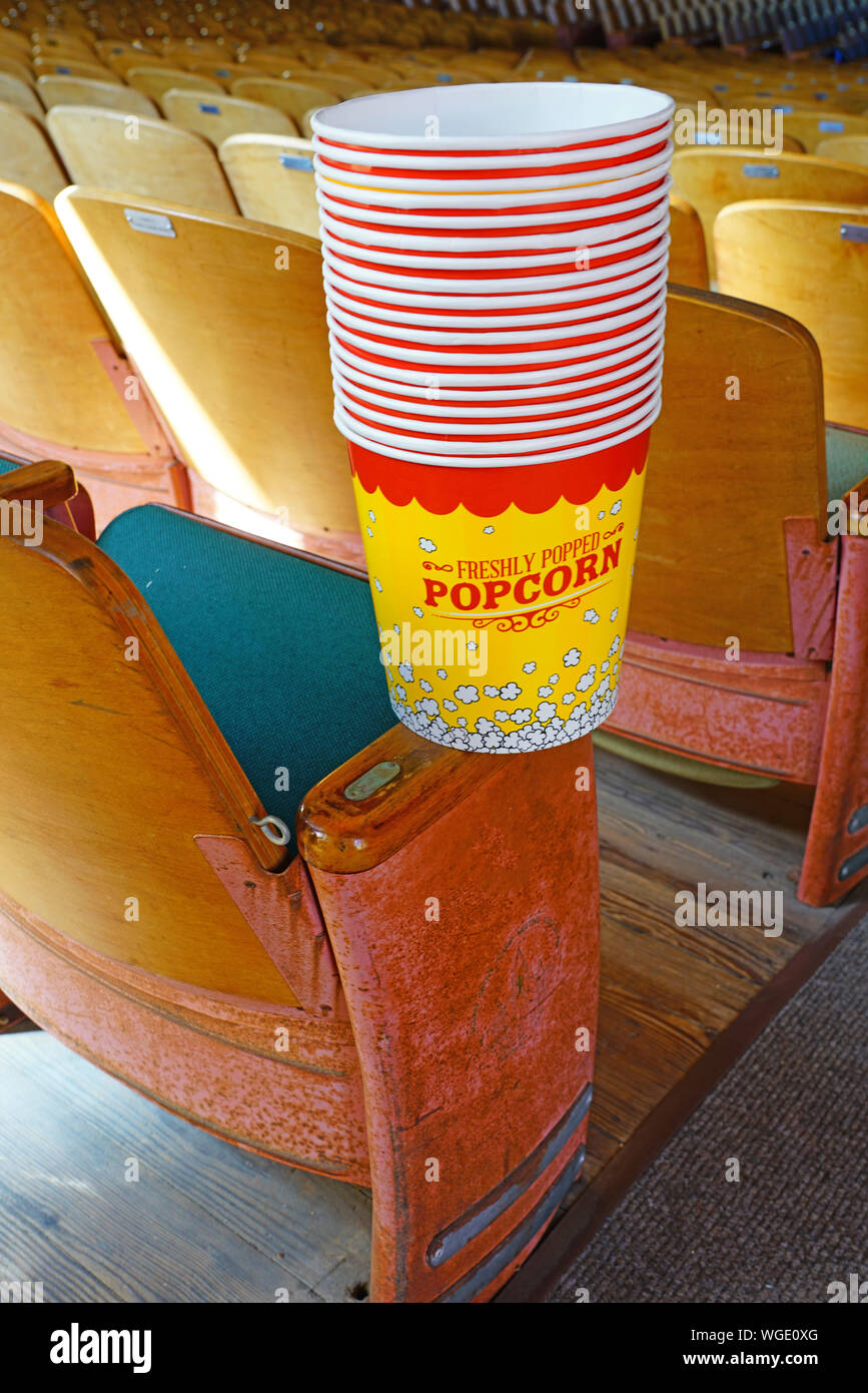 Stacked empty buckets of freshly popped popcorn in a theater Stock