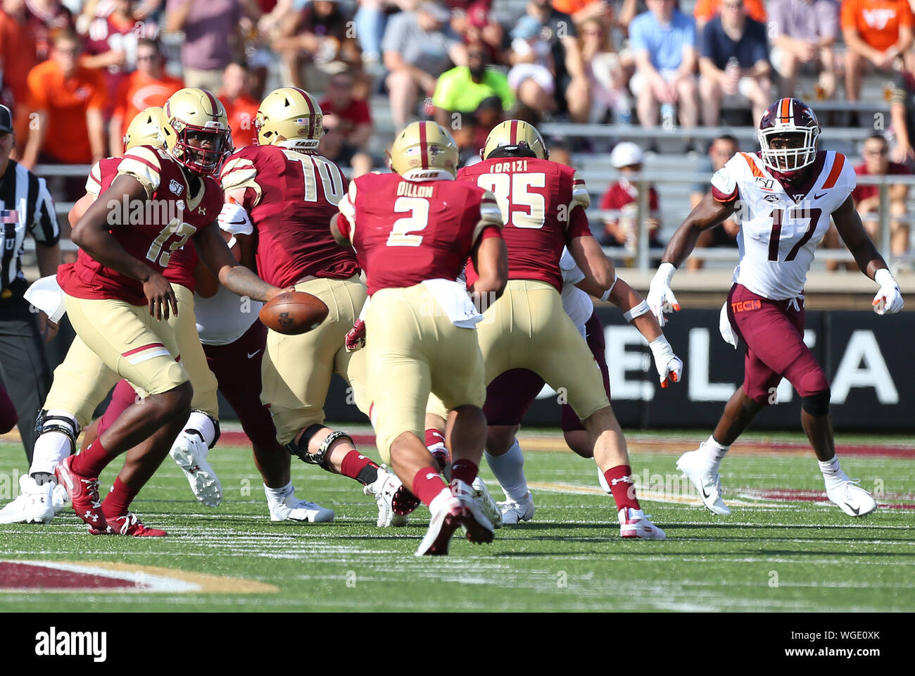 August 31, 2019; Chestnut Hill, MA, USA; Boston College Eagles quarterback Anthony Brown (13) hands off to Boston College Eagles running back AJ Dillon (2) during the NCAA football game between Virginia Tech Hokies and Boston College Eagles at Alumni Stadium. Anthony Nesmith/CSM Stock Photo