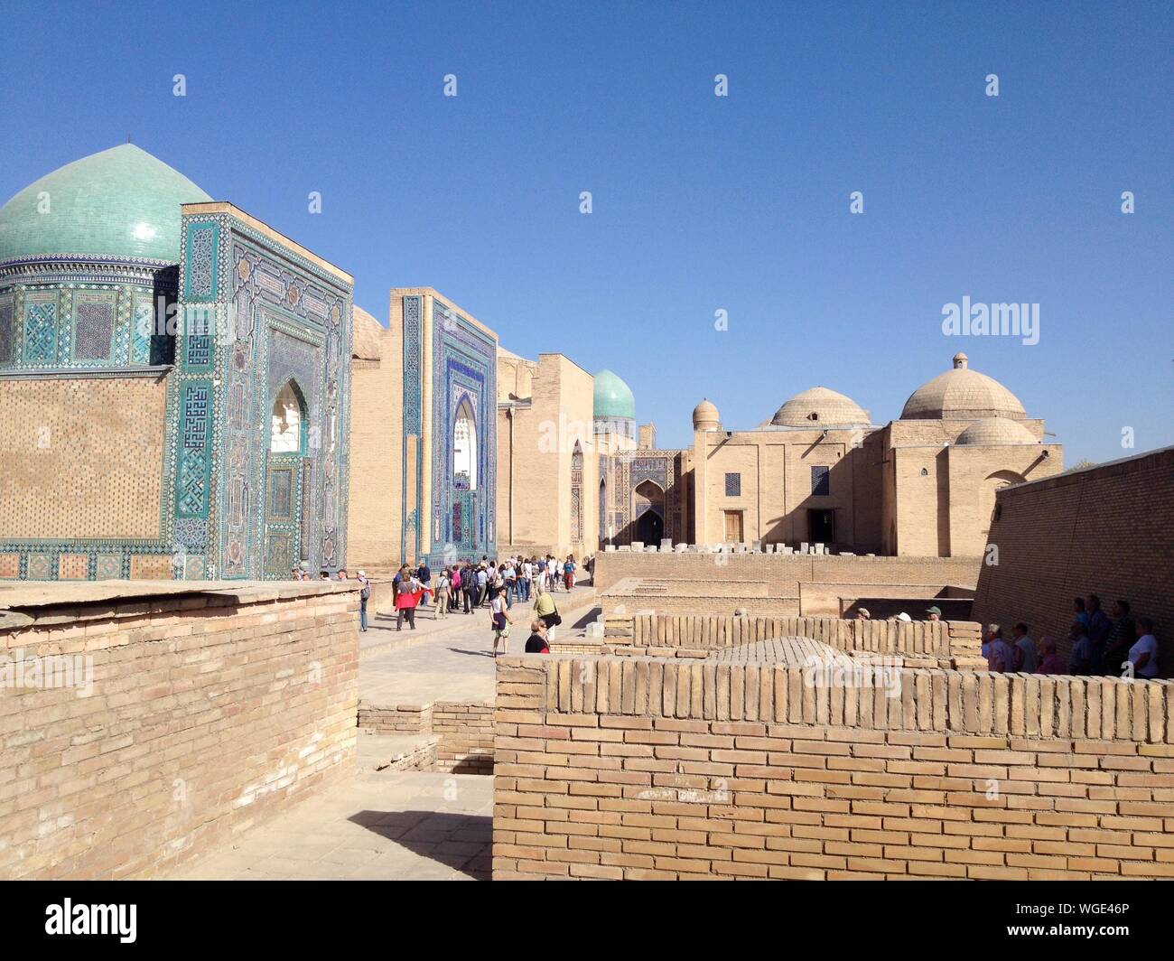 Group Of People At Holy Place Against Clear Blue Sky Stock Photo