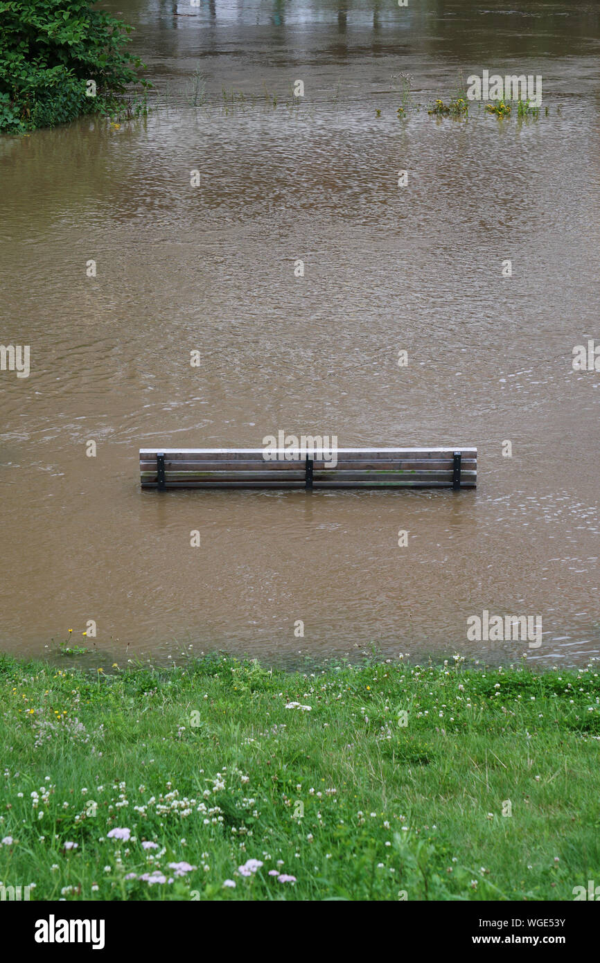 High Angle View Of Bench Amidst Flooded Water At Park Stock Photo