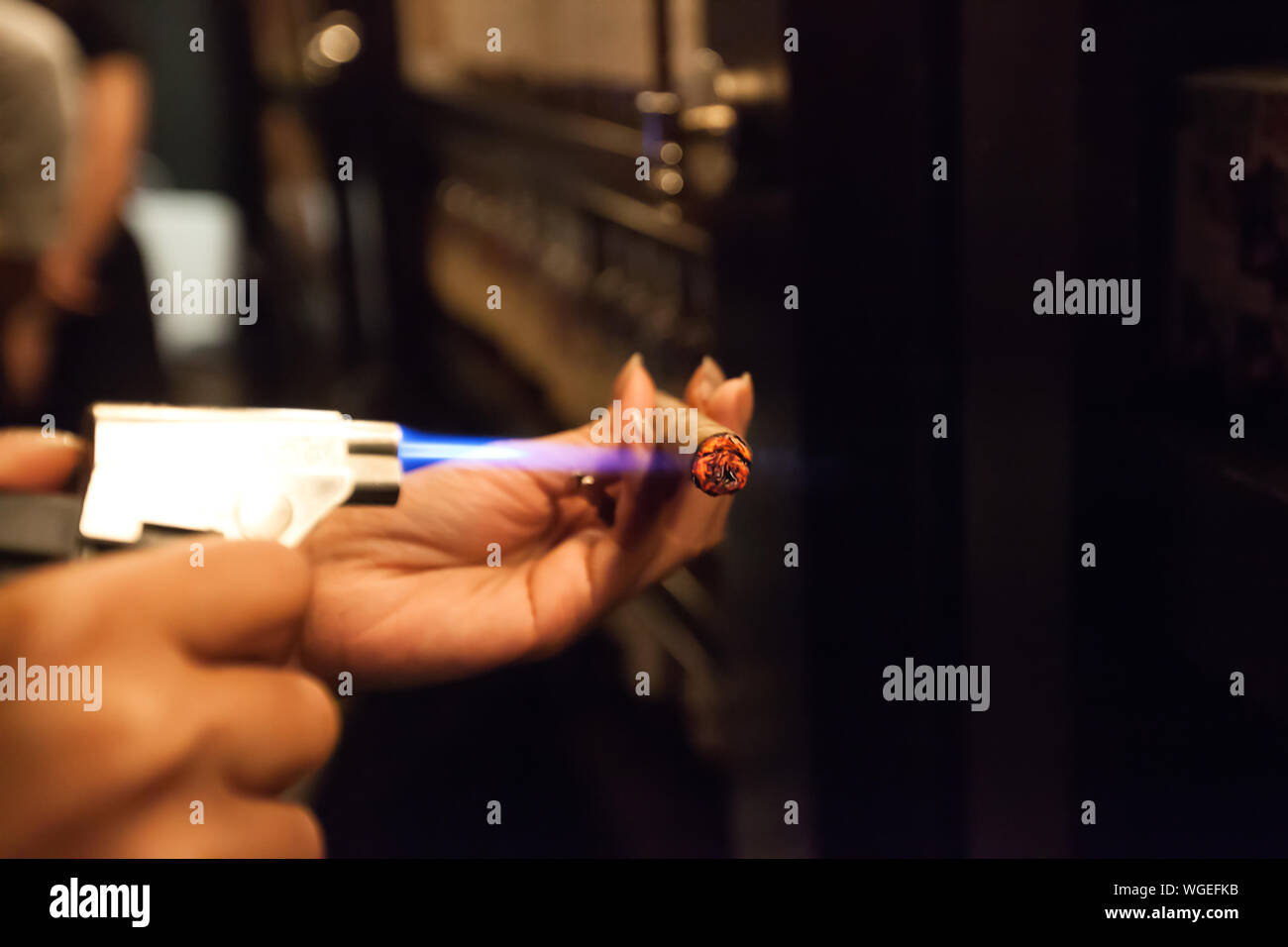 Burning cigar hi-res stock photography and images - Alamy
