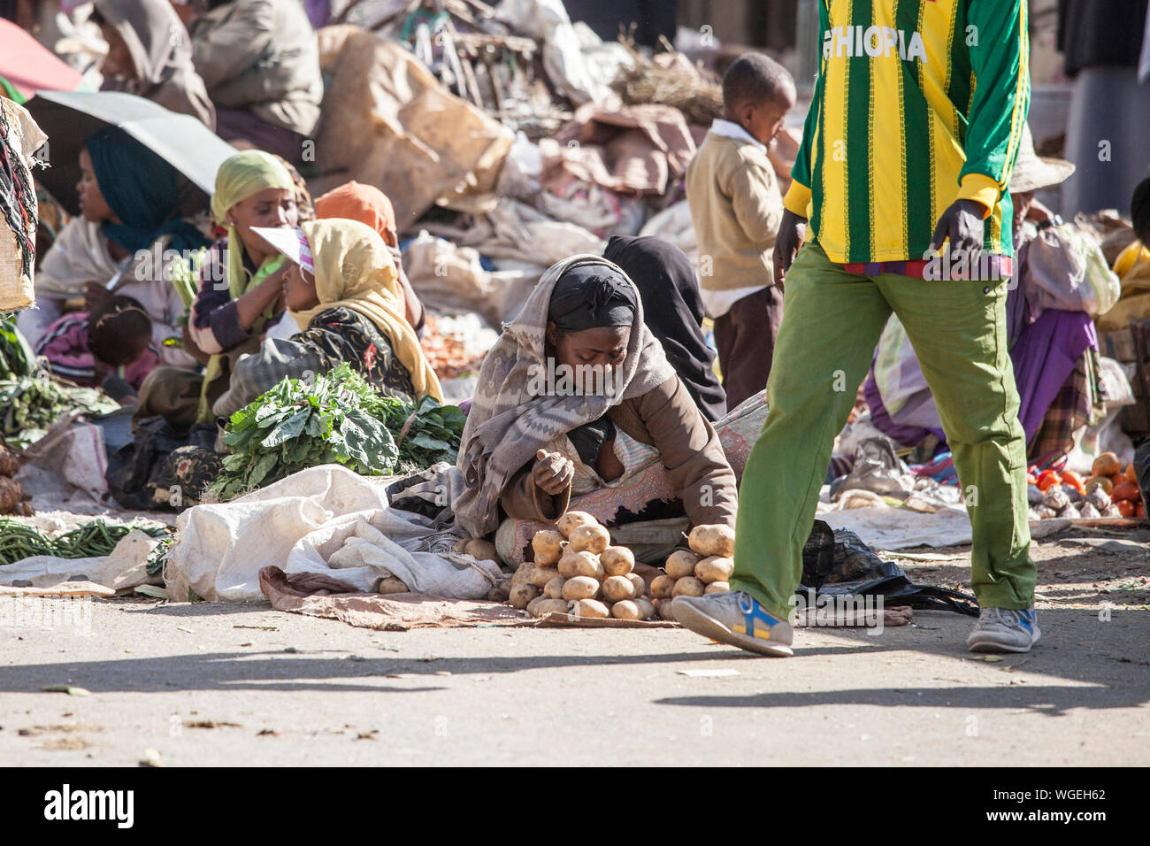 ADDIS ABABA, ETHIOPIA-October 31, 2014 Unidentified women and children sell vegetables at an outdoor market in Addis Ababa, Ethiopia Stock Photo