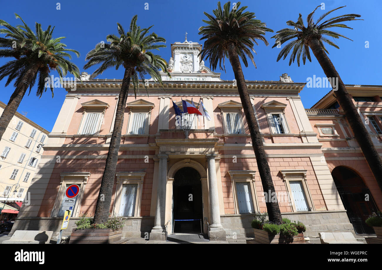 The city hall of Ajaccio framed by palm fronds, Corsica island, France. Stock Photo