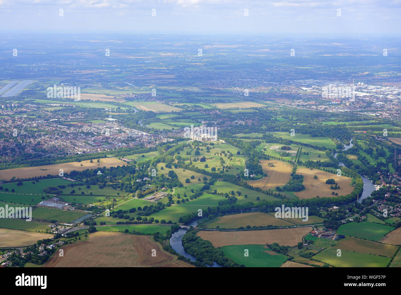 WINDSOR, ENGLAND -21 AUG 2019- Aerial view of the town of Windsor and the Windsor Castle, property of the British Monarchy in Windsor, England, United Stock Photo