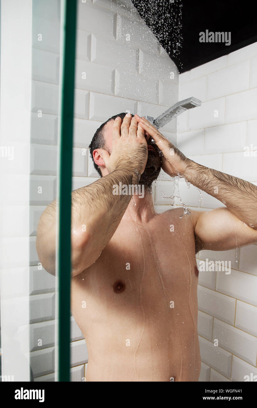 Shirtless Mid Adult Man Taking Shower In Bathroom Stock Photo - Alamy
