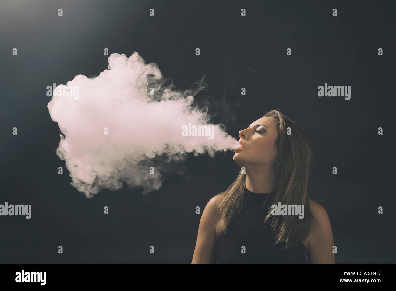 Woman exhaling smoke hires stock photography and images Alamy
