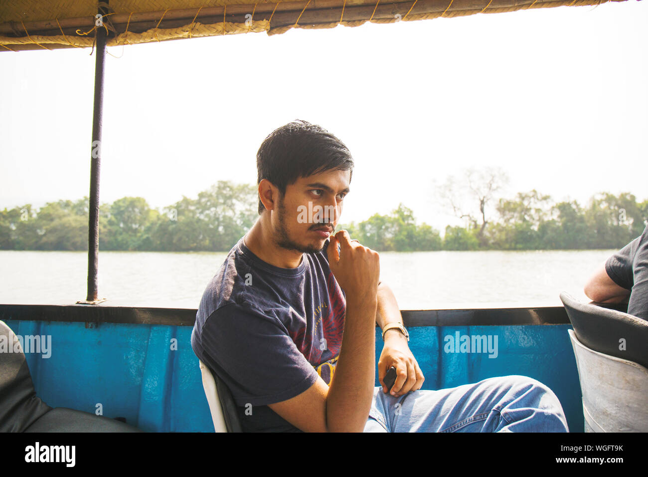 Indian man sitting on boat hi-res stock photography and images - Alamy