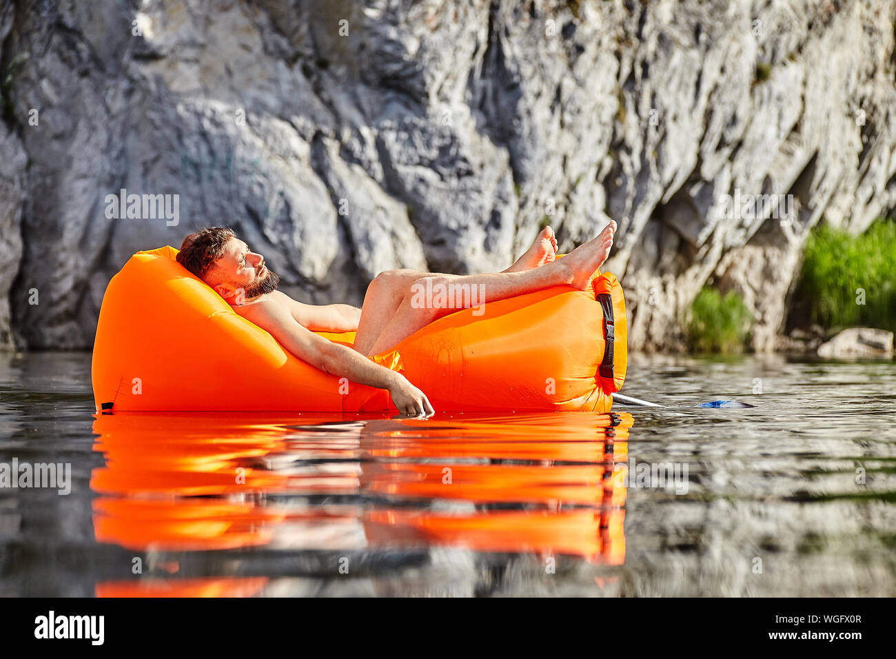 Man sleeping in inflatable boat hires stock photography and images Alamy