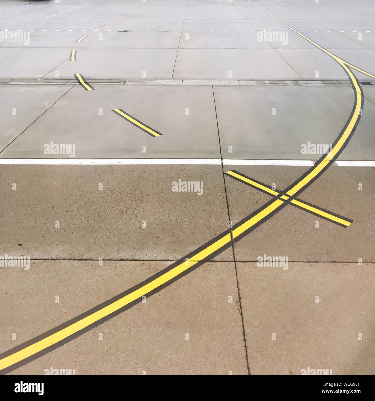 Download High Angle View Of Yellow Lines On Airport Runway Stock Photo Alamy PSD Mockup Templates