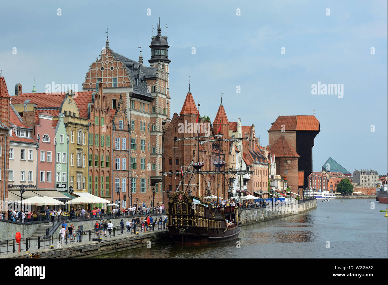Cityscape of Gdansk at the river Motlawa with Crane gate and Old sailing ship - Poland. Stock Photo