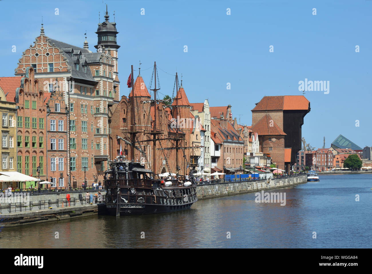 Cityscape of Gdansk at the river Motlawa with Crane gate and Old sailing ship - Poland. Stock Photo