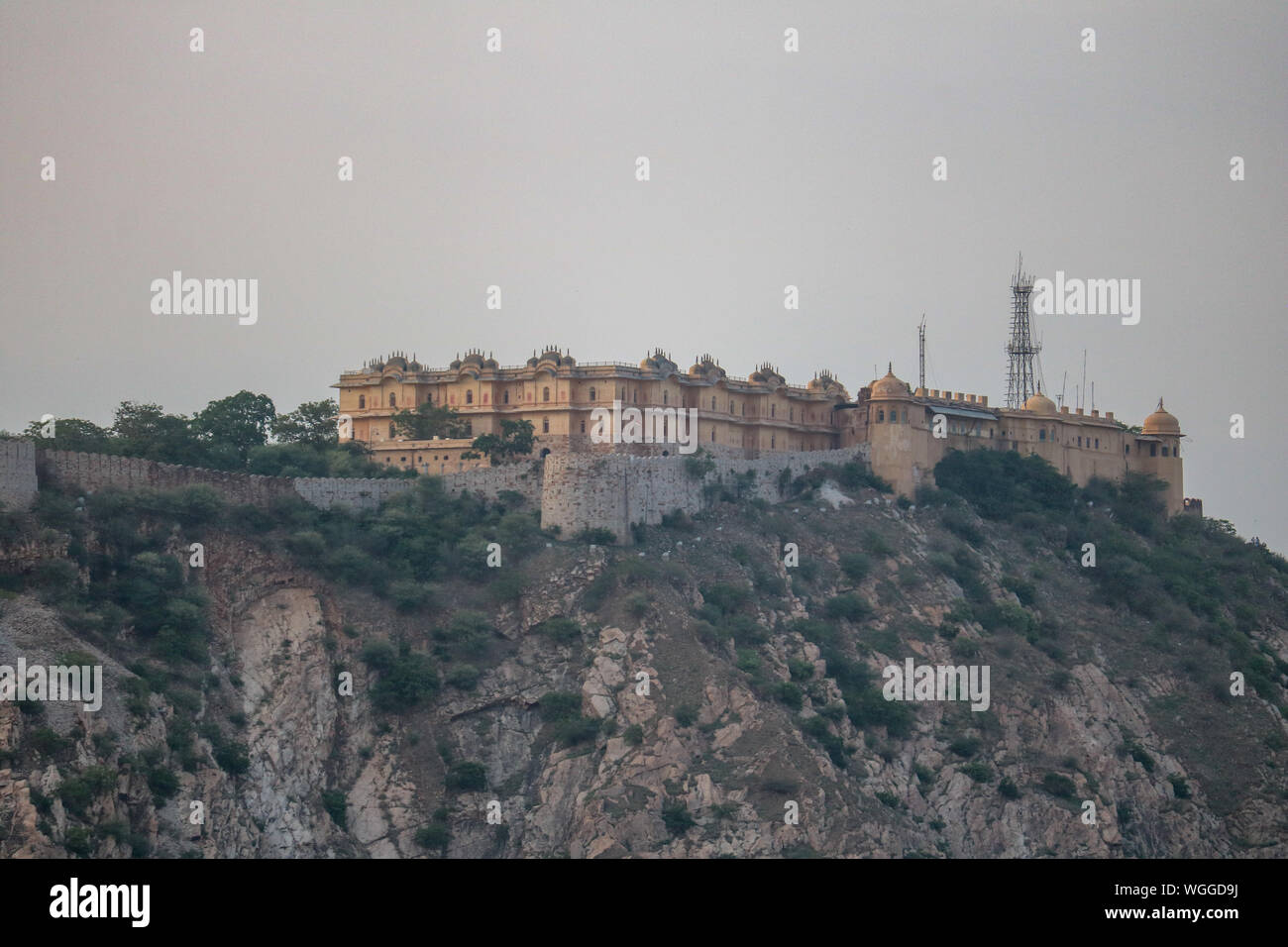 View of the Nahargarh fort over the rooftops of the Pink City of Jaipur, India Stock Photo