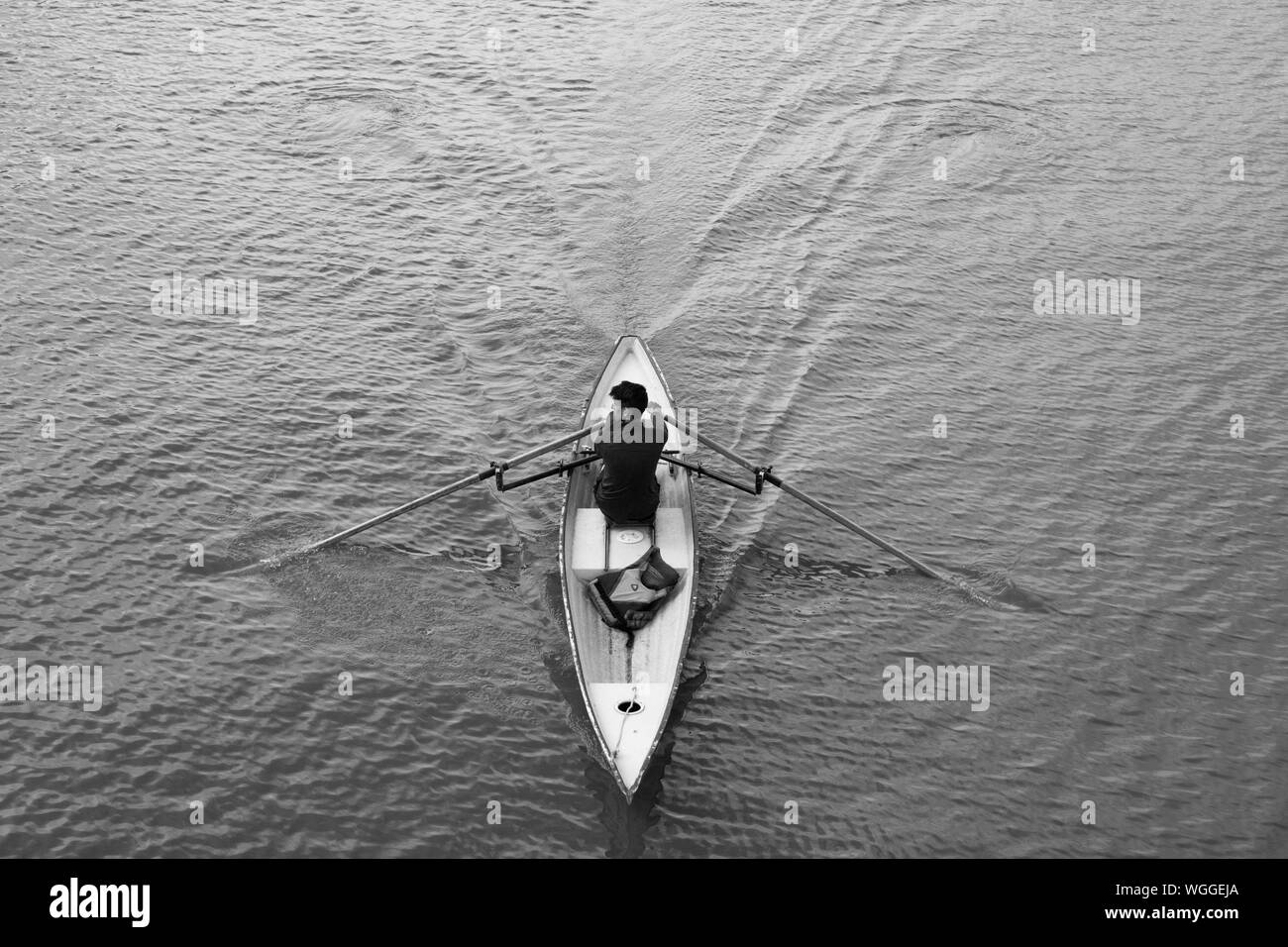 Men in rowing boat Black and White Stock Photos & Images - Alamy