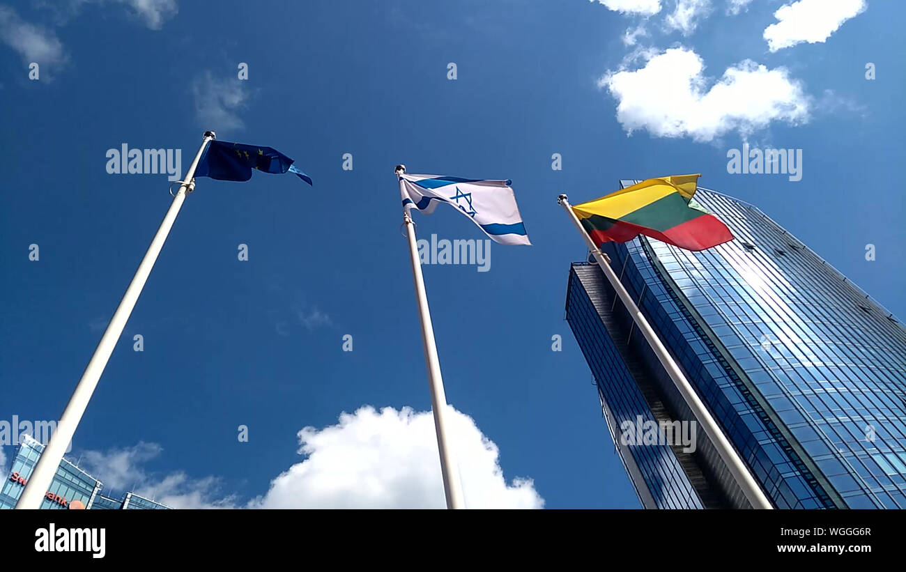 Waving European Union flag, Israel flag and Lithuanian flag in the wind ...
