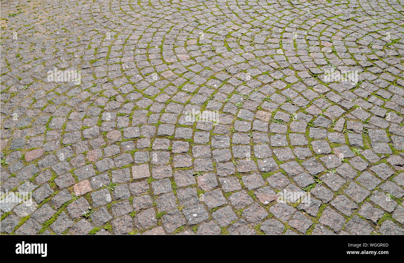 Ancient granite paved stones texture in Peter and Paul fortress, St Petersburg, Russia. Pavement pattern background laid in an circular arc Stock Photo