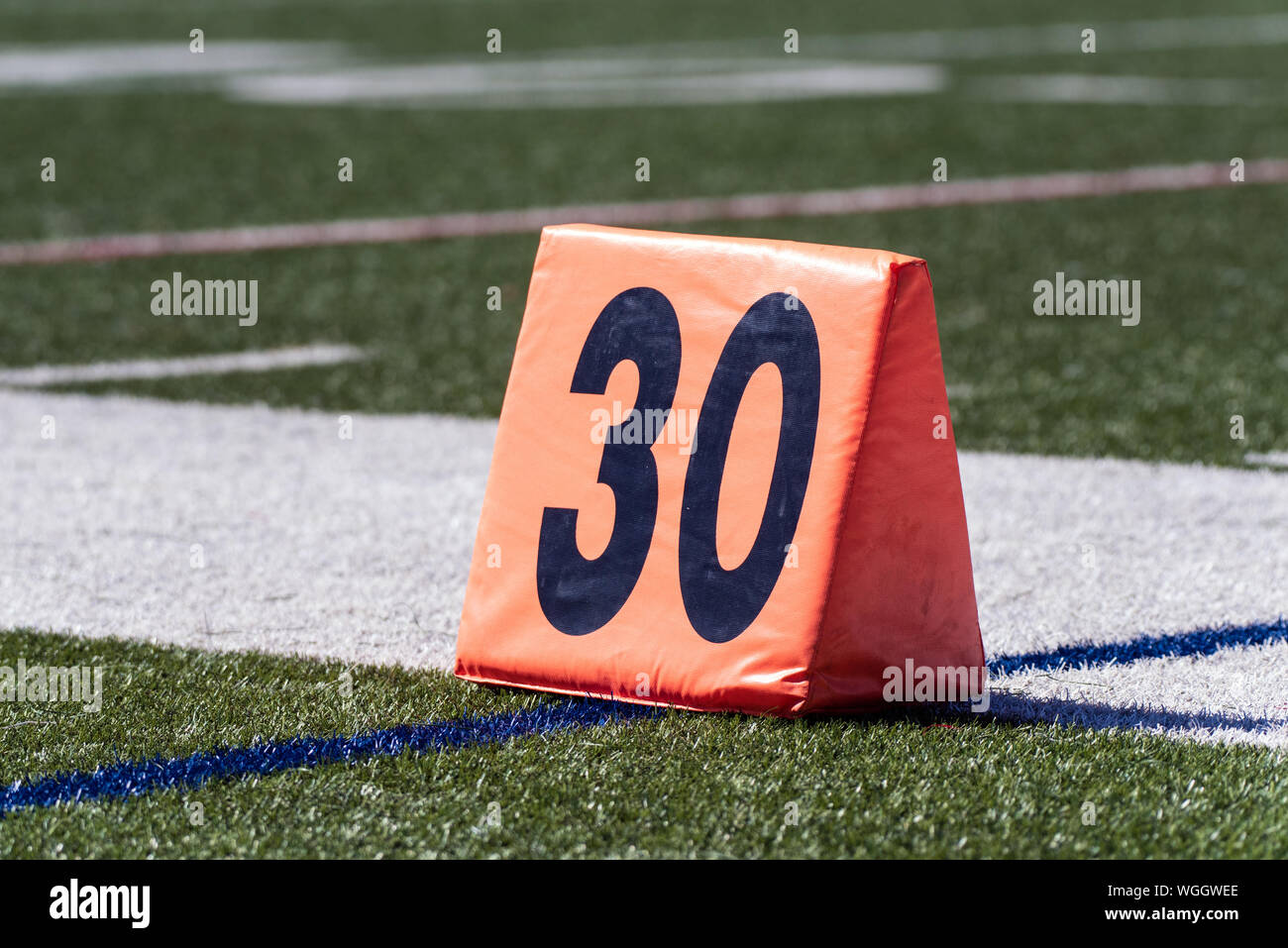 Football 30 yard line is shown just outside the sideline. Stock Photo