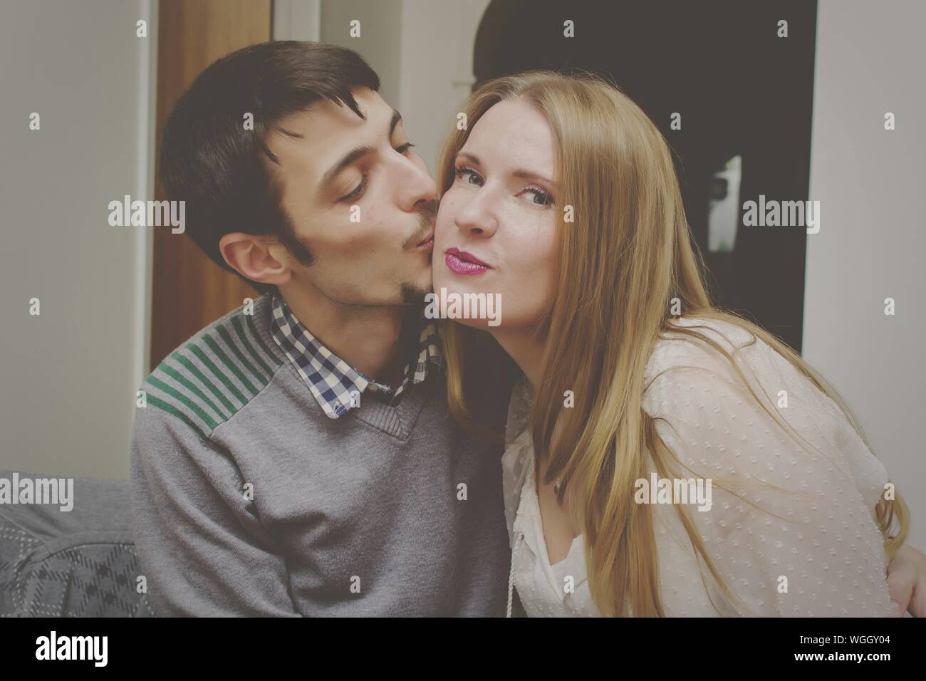 Beautiful woman kissing man hi-res stock photography and images - Alamy