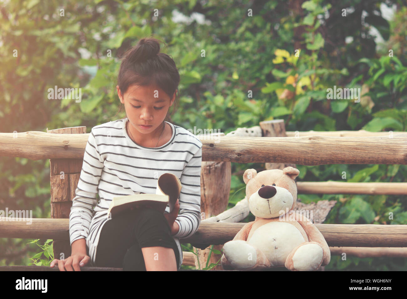 Indian girl sitting on bench hi-res stock photography and images - Alamy