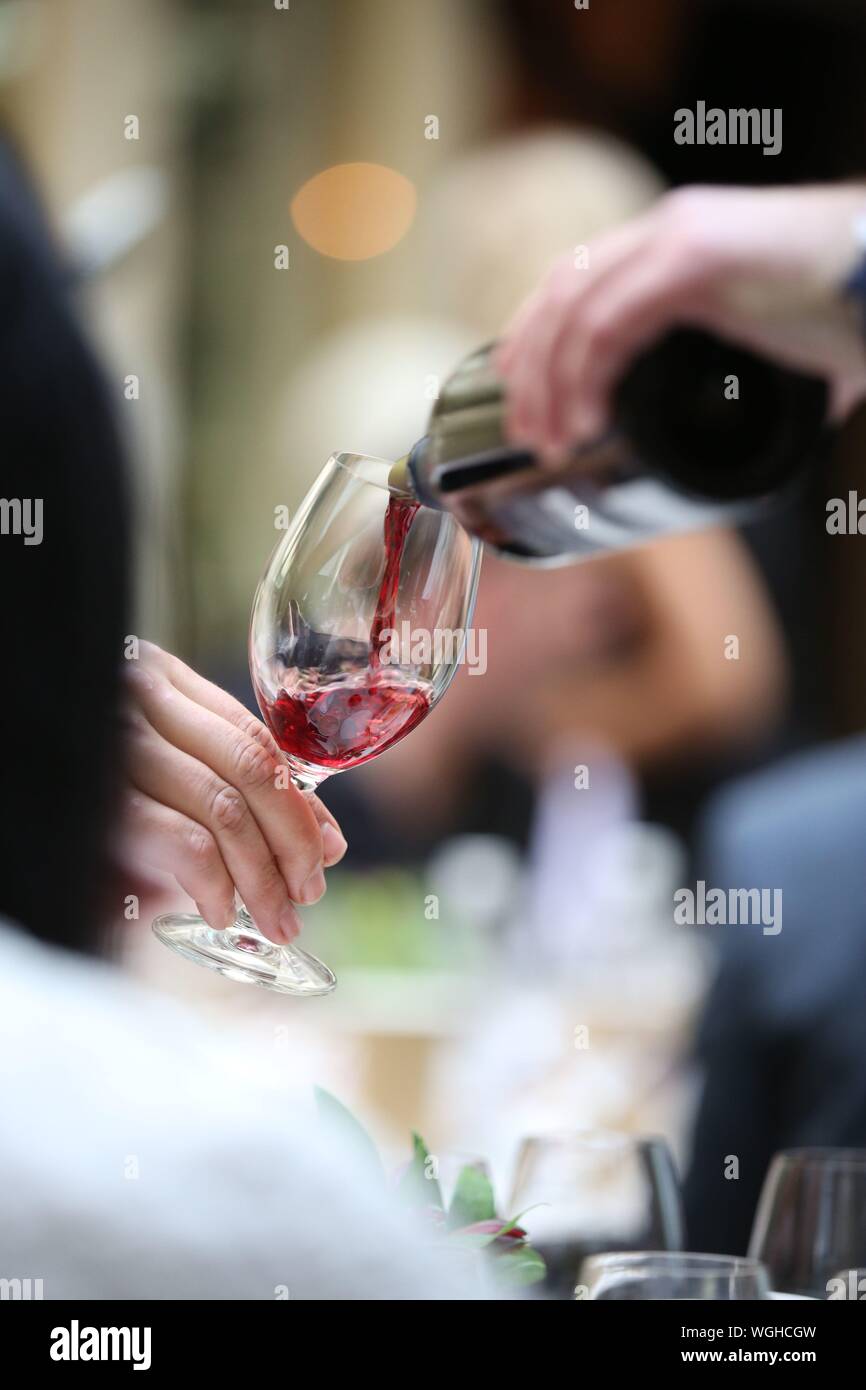 Wine waiter pouring wine hires stock photography and images Alamy