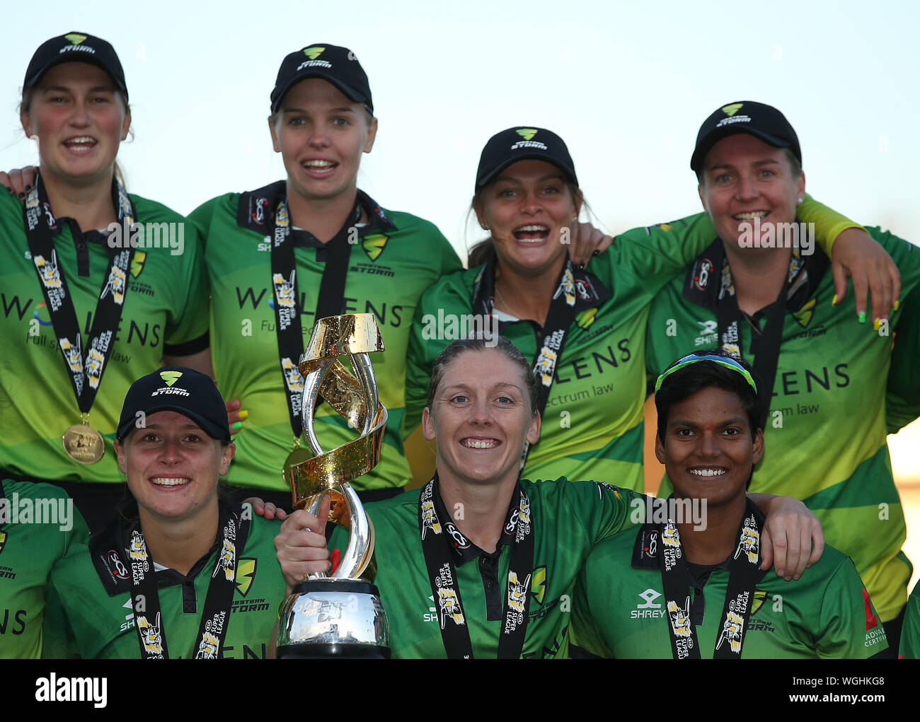Western Storm's Heather Knight (centre) celebrates with the trophy with teammates after winning during Kia Super League final at the 1st Central County Ground, Hove. Stock Photo