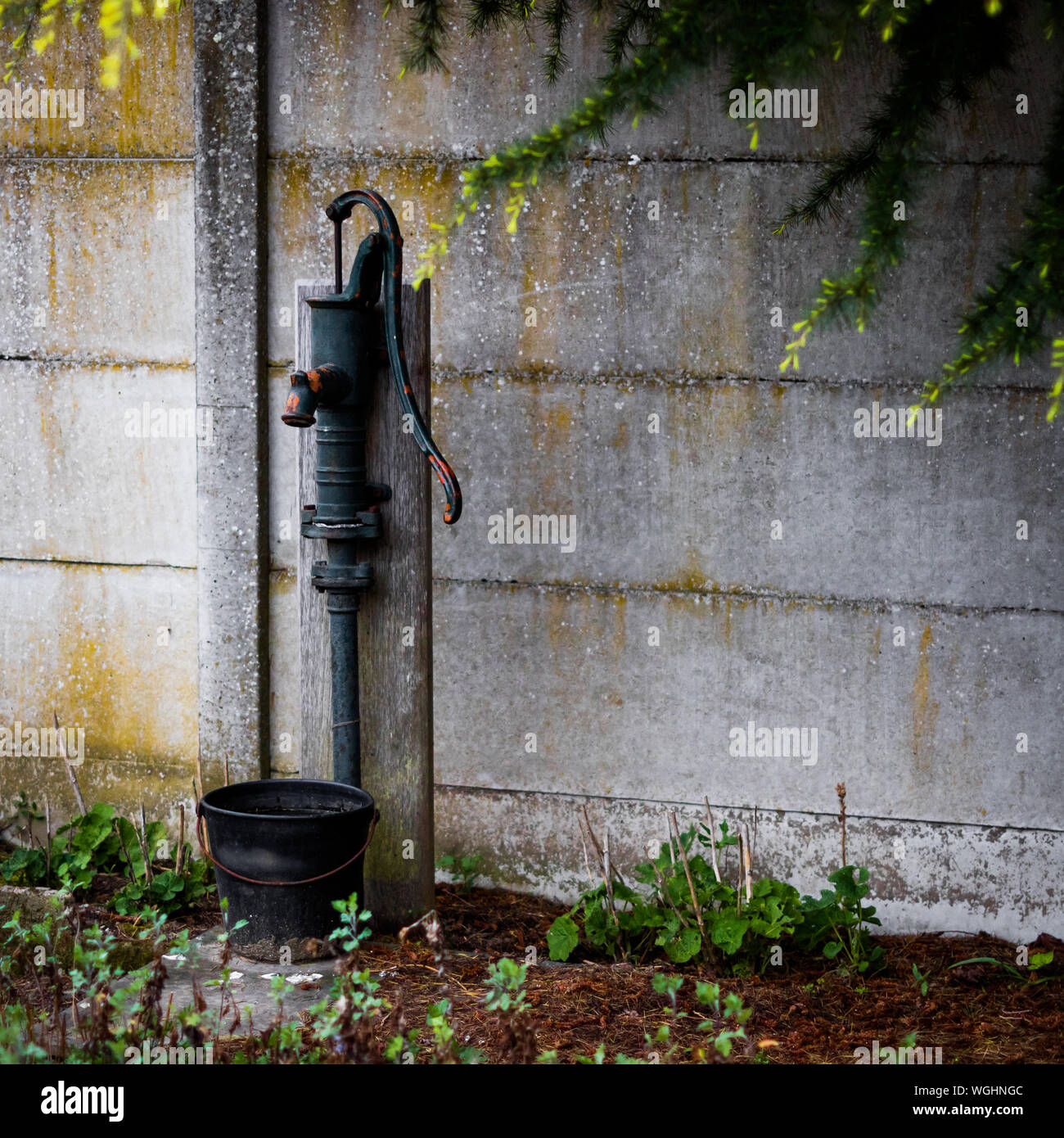 Hand Pump Against The Wall Stock Photo