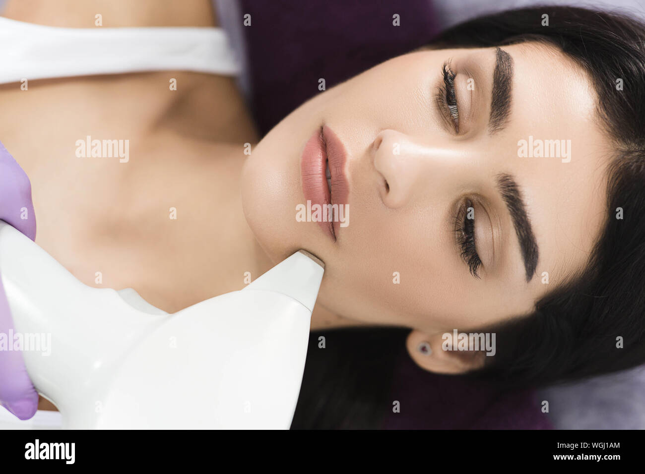 Pretty woman getting hair removing on face. Procedure laser