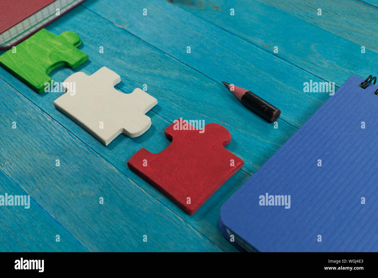 Problem solving and teamwork concept with colorful puzzle pieces in red ...