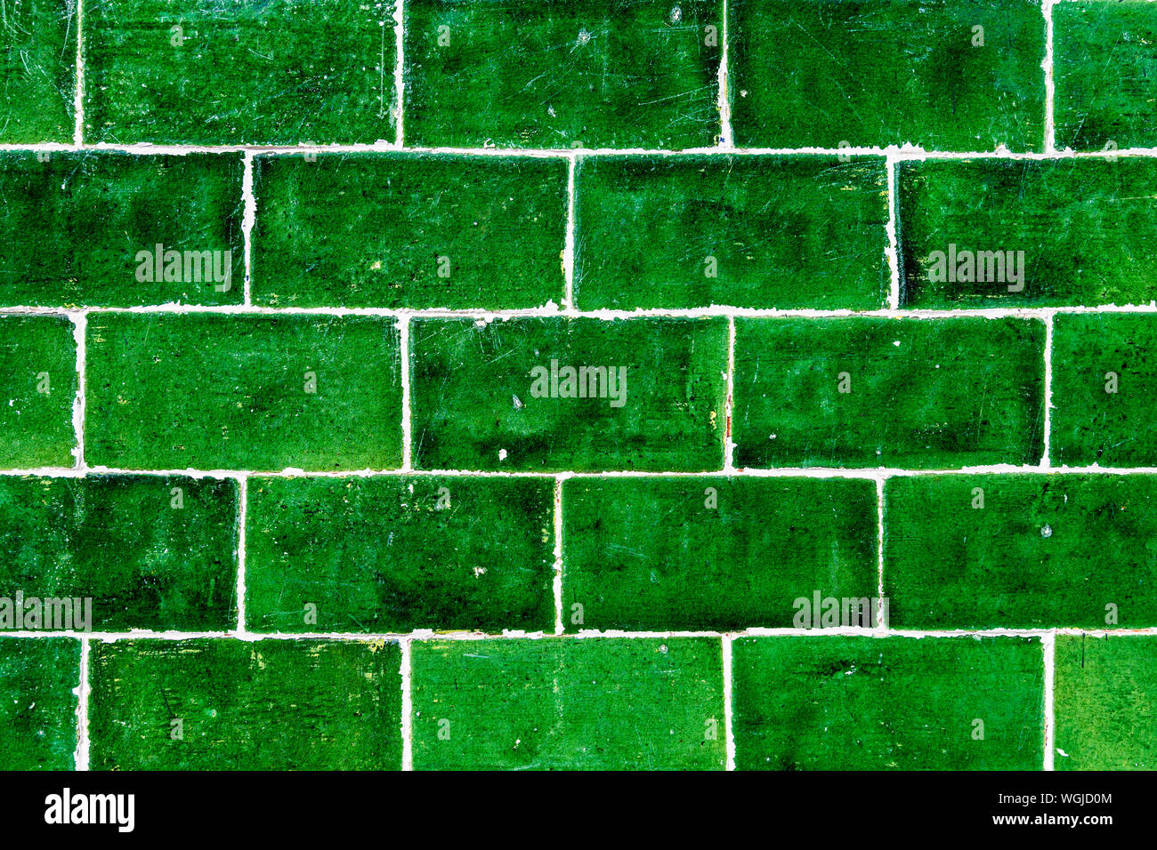 Green ceramic tiles on an exterior pub wall (Abbey Arms, Abbey Wood Village, UK) Stock Photo