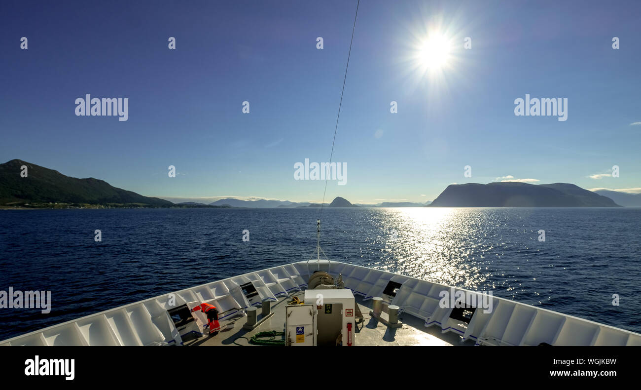 shipwright on top of the Polarlys, cruise ship, mountains, rocks, water, sky, Godøya, Møre og Romsdal, Norway, Scandinavia, Europe, NOR, travel, touri Stock Photo