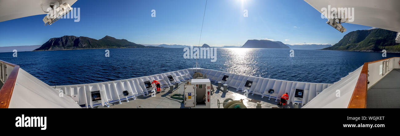 Shipwright on top of the Polarlys, panorama, cruise ship, mountains, rocks, water, sky, Godøya, Møre og Romsdal, Norway, Scandinavia, Europe, NOR, tra Stock Photo