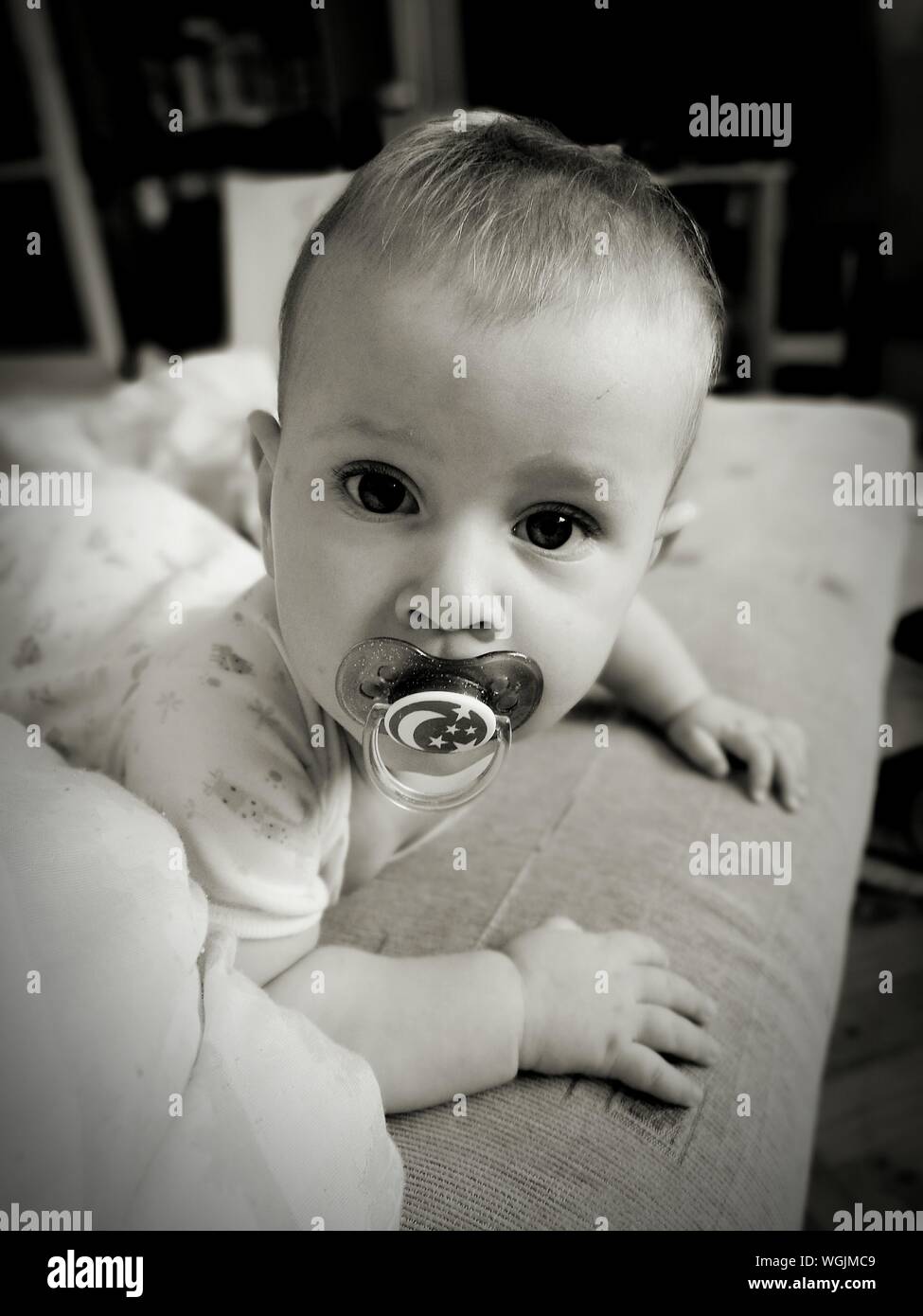 Baby bed pacifier hires stock photography and images Alamy