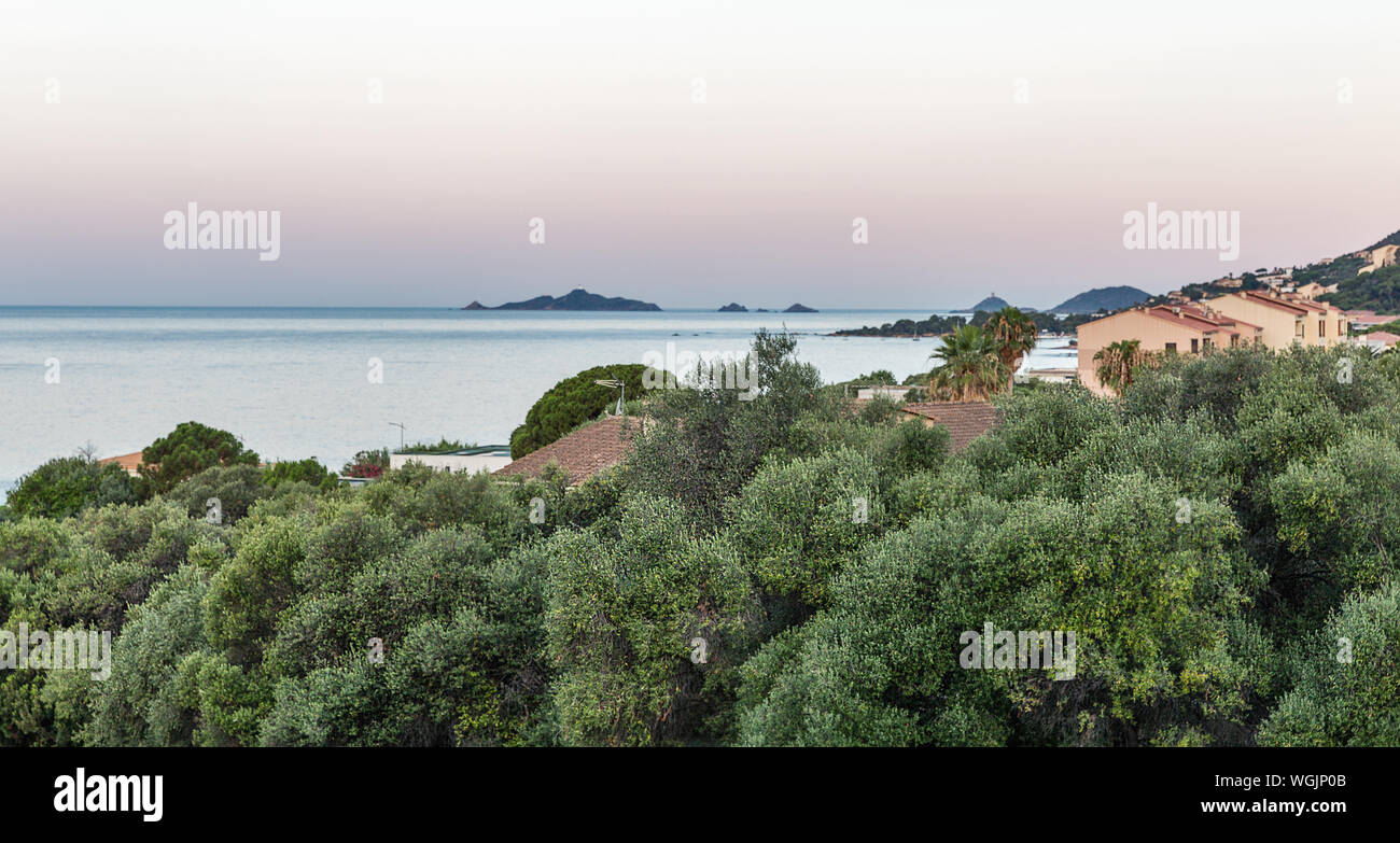 Beautiful evening seascape with island, old tower and lighthouse in Ajaccio, Corsica island, France. Pointe de la Parata on the west coast with ruined Stock Photo