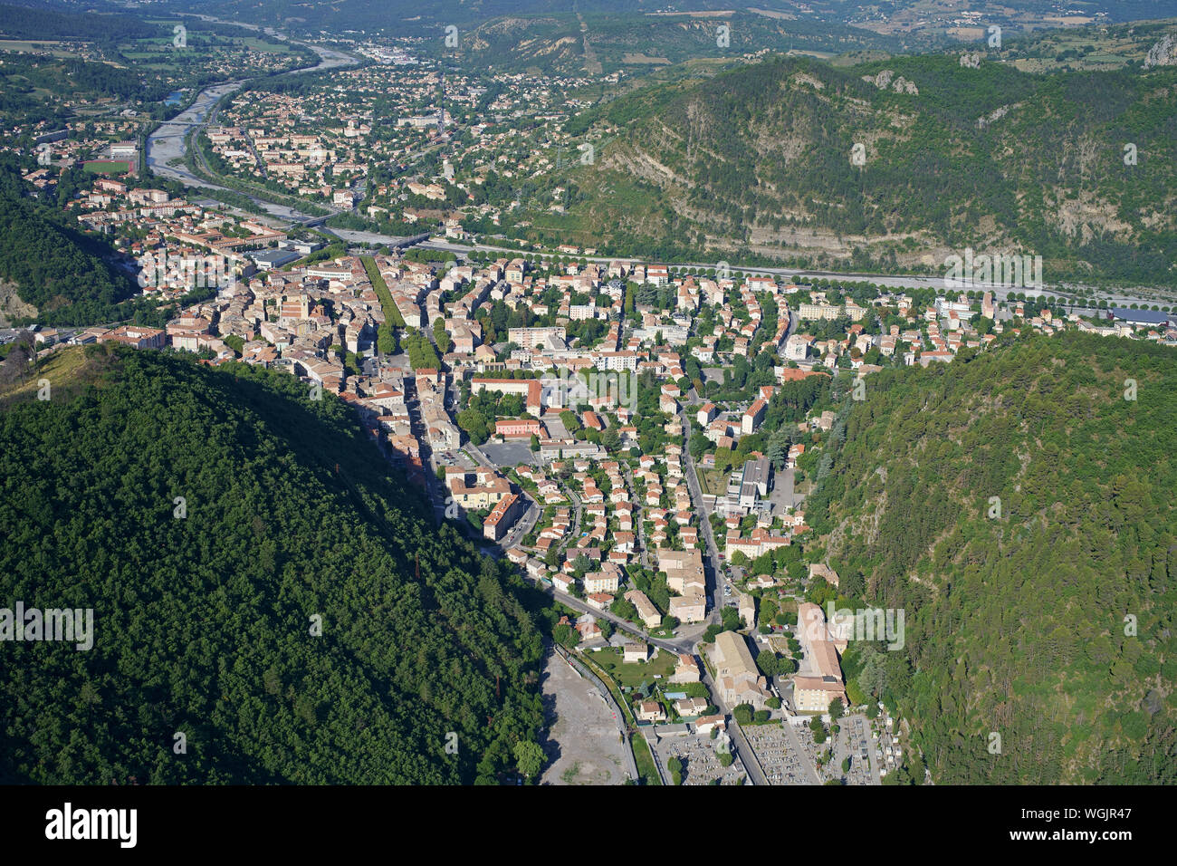 AERIAL VIEW. Spa town of Digne-les-Bains nestled in the Bléone Valley. Alpes de Haute-Provence, Provence-Alpes-Côte d'Azur, France. Stock Photo