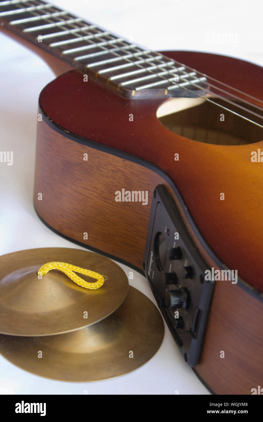 Close up of traditional guitar and small cymbals. Stock Photo