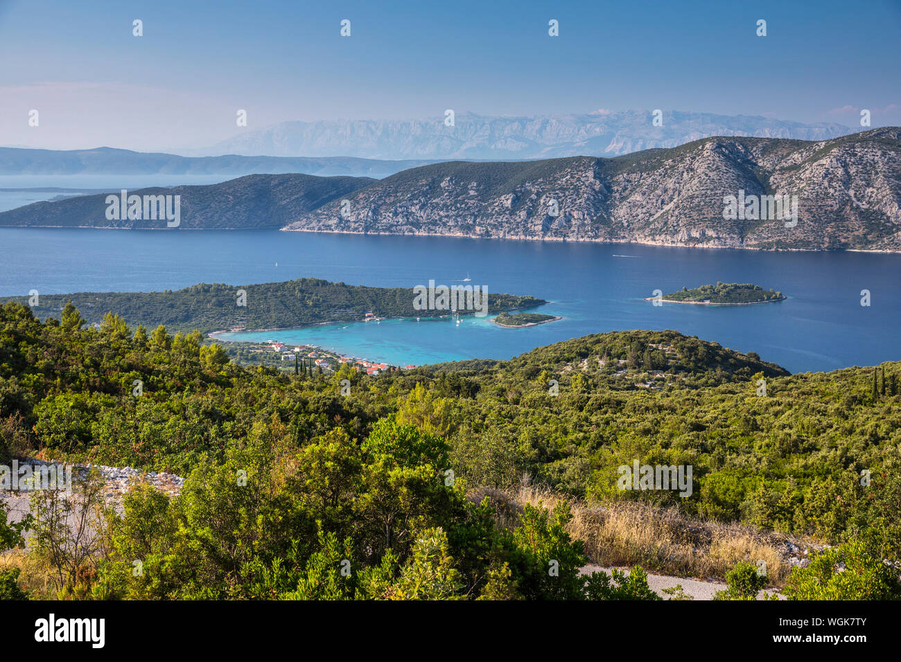Kneza bay from the hill of Korcula island. Peninsula Peljesac on the back and Velebit mountain in a distance. Stock Photo