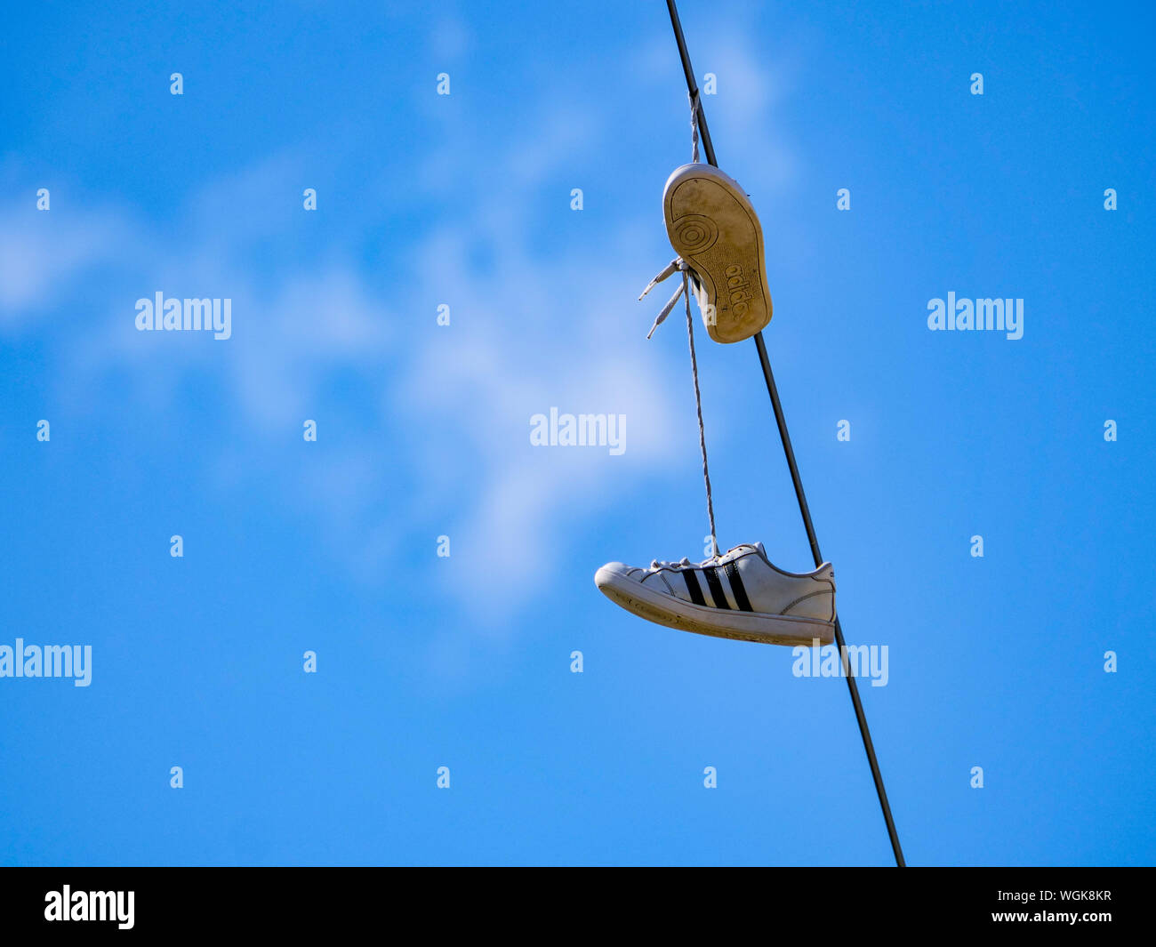 Shoes hanging from line hi-res stock photography and images - Page 3 - Alamy