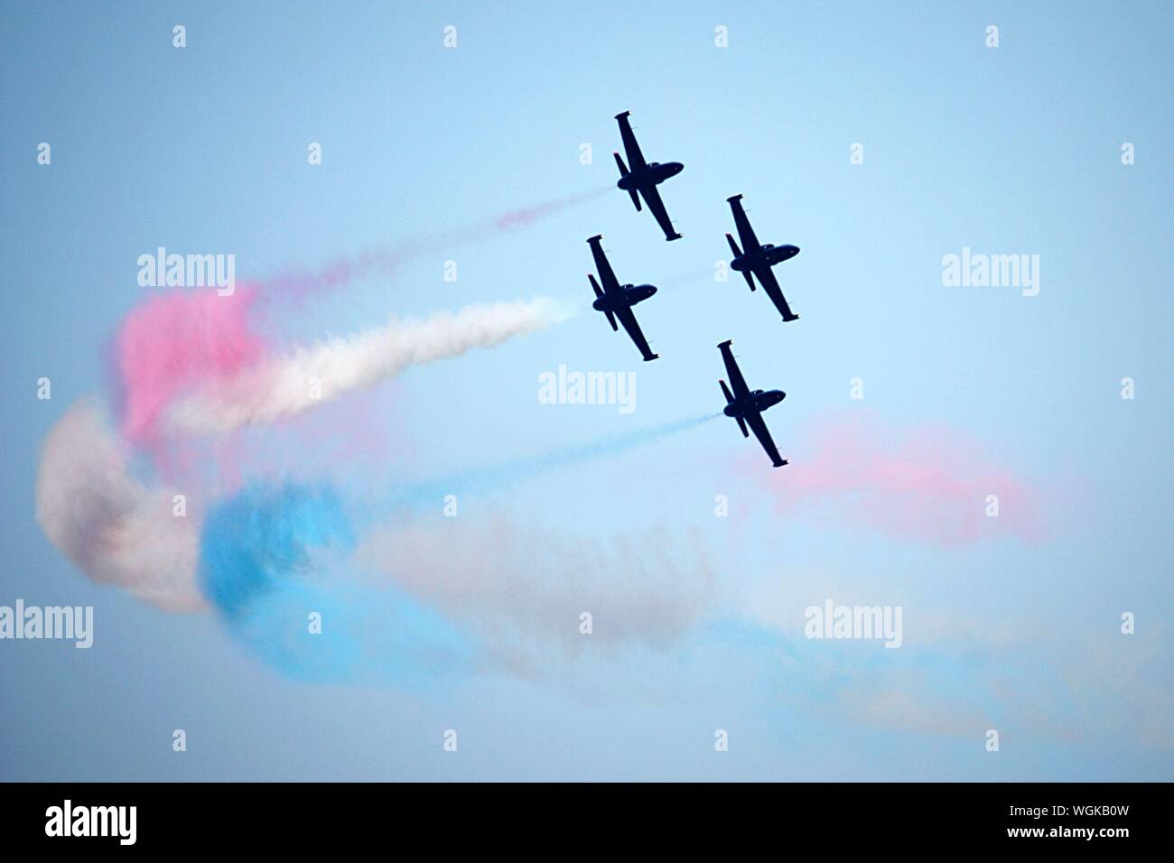 Low Angle View Of The Silhouette Fighter Jets Performing Airshow Stock Photo