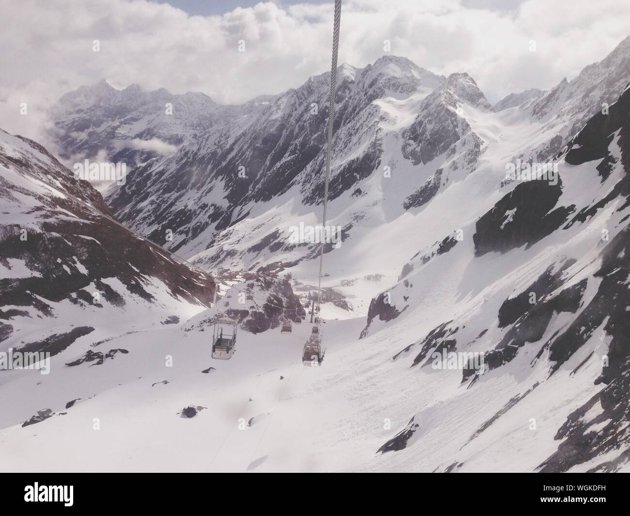 Ski Lift In Stubaier Gletscher Against Snowcapped Mountain Stock Photo