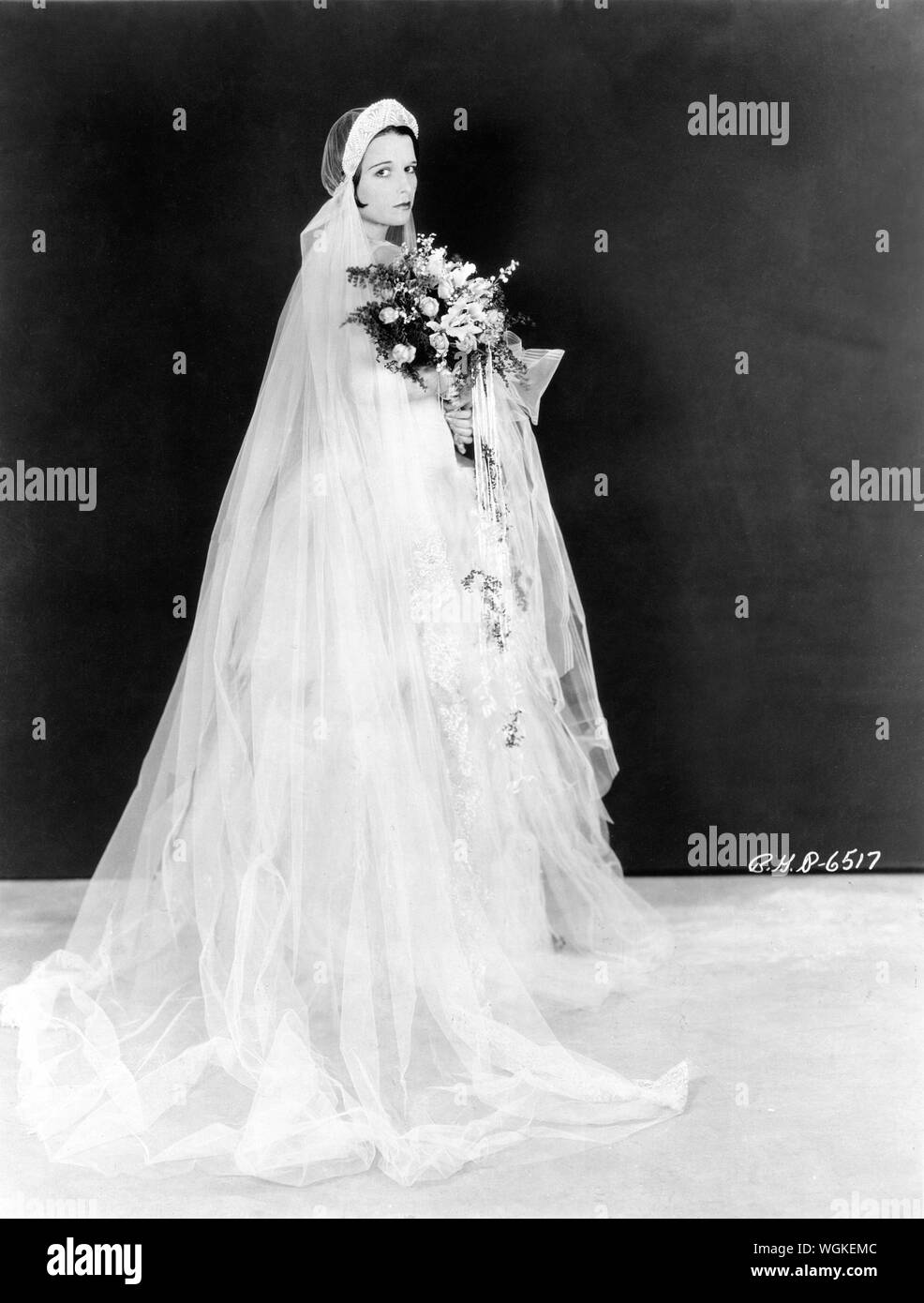 LOUISE BROOKS circa 1928 Publicity Portrait in Wedding Dress Famous Players - Lasky Corporation / Paramount Pictures Stock Photo