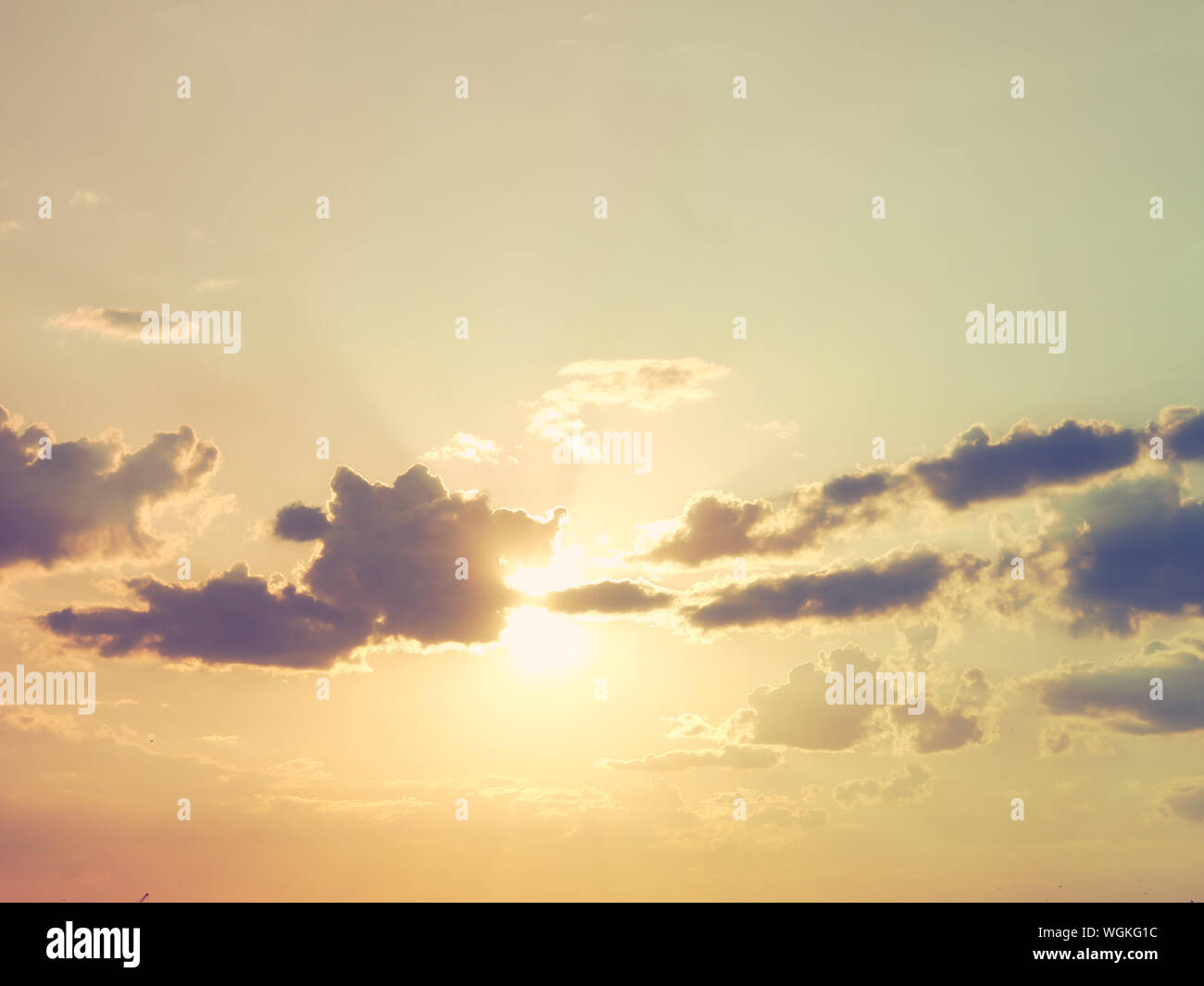 Sun Shining Through Clouds Stock Photo