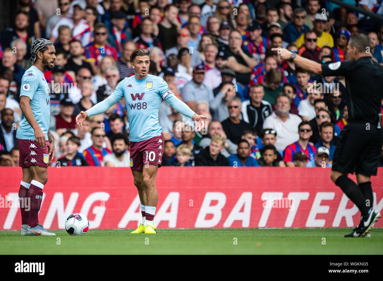 LONDON, ENGLAND - AUGUST 31: Jack Grealish and Douglas Luiz of Aston Villa and referee Kevin Friend during the Premier League match between Crystal Palace and Aston Villa at Selhurst Park on August 31, 2019 in London, United Kingdom. (Photo by Sebastian Frej/MB Media) Stock Photo