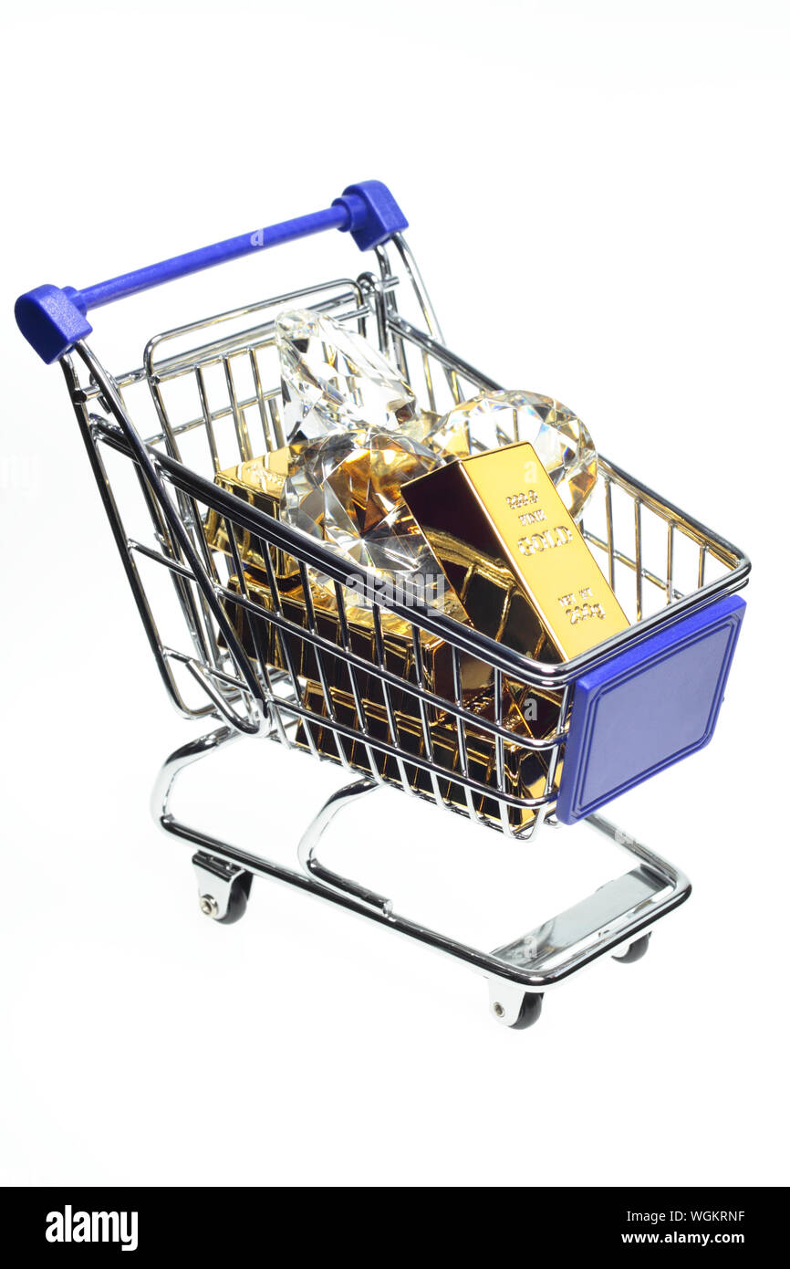 Close-up Of Gold Ingots In Shopping Basket Against White Background Stock Photo