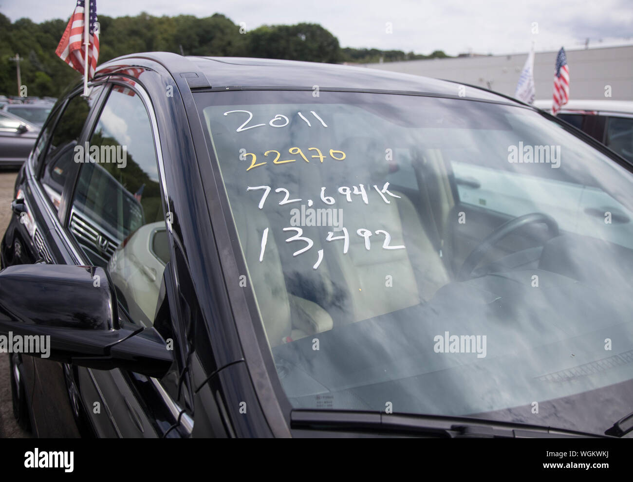 Price of a used car on the windshield of Honda automobiles Stock Photo