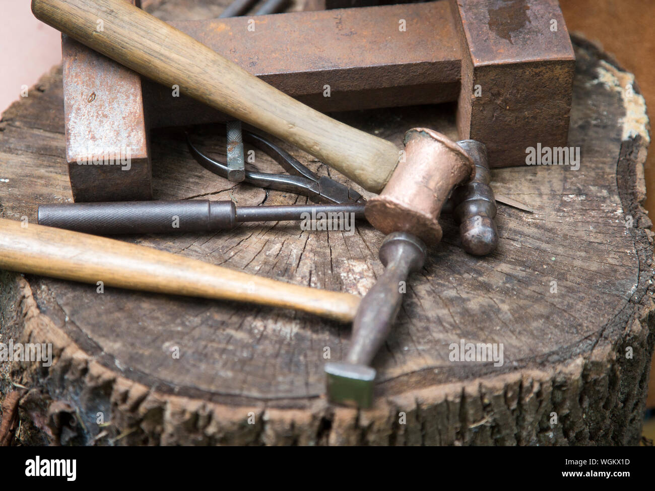 A blacksmith's hammers on a bench Stock Photo