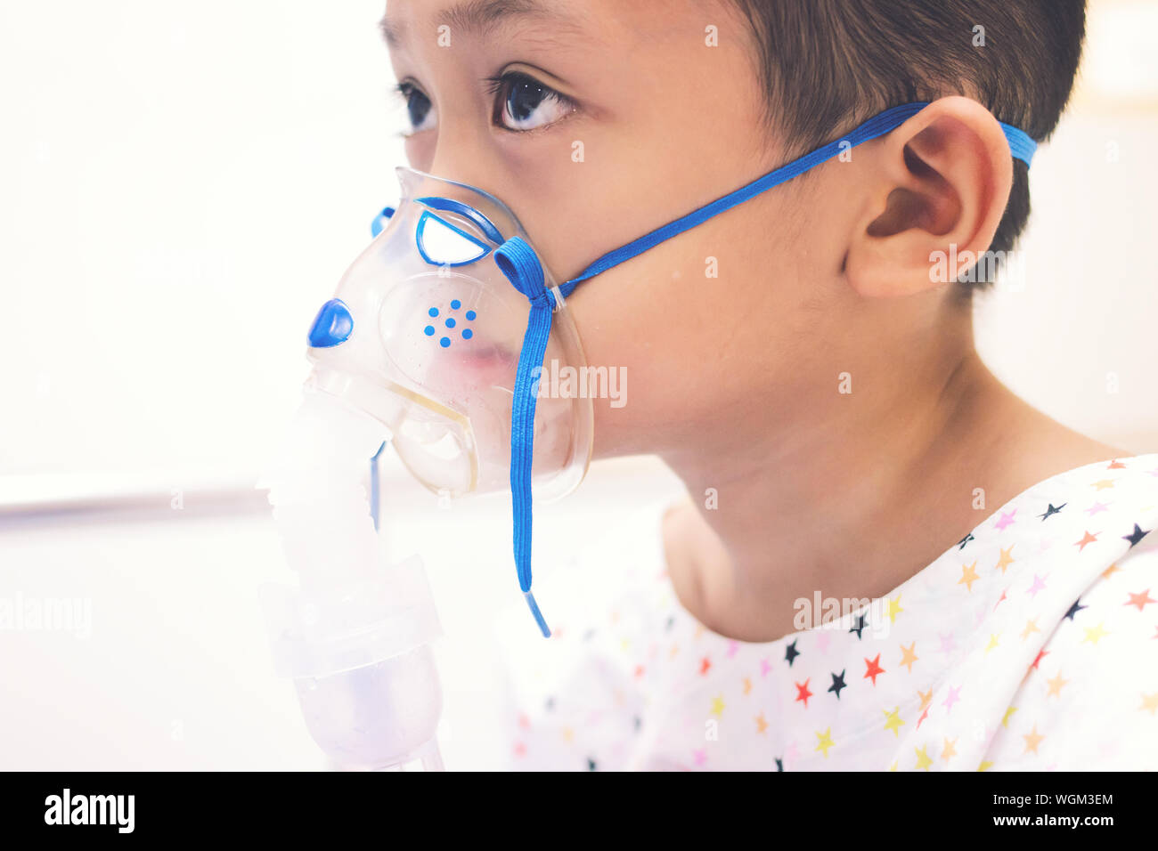 Close-up Of Boy Wearing Gas Mask Stock Photo