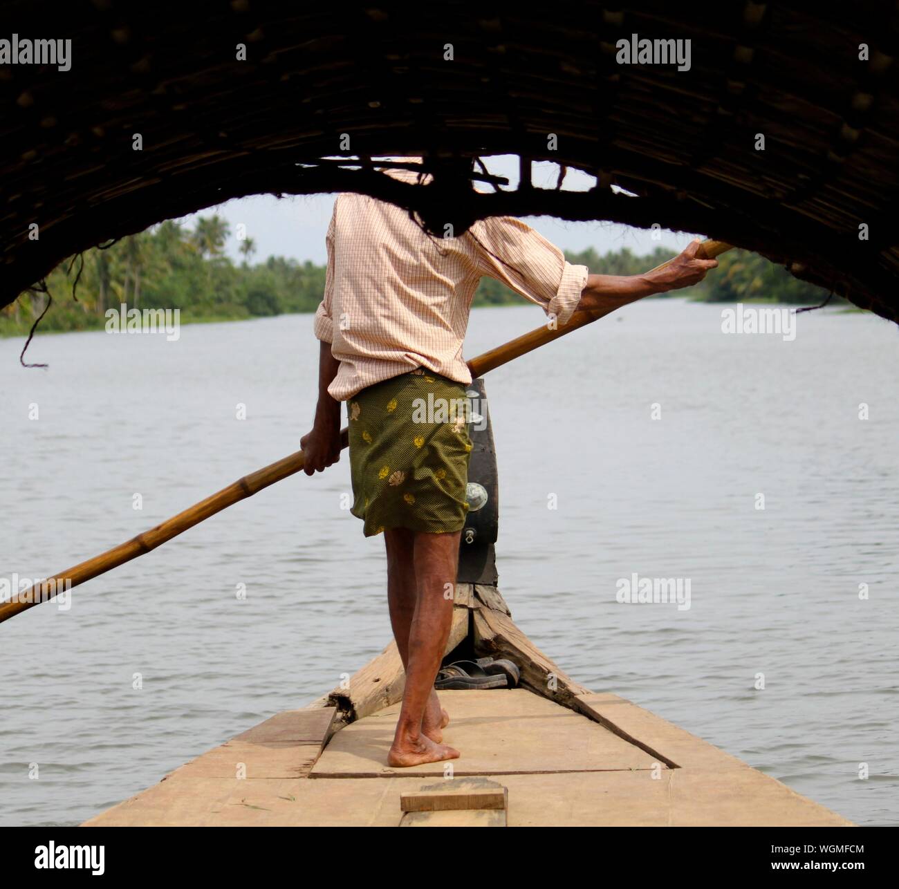 Man on longtail boat hi-res stock photography and images - Alamy