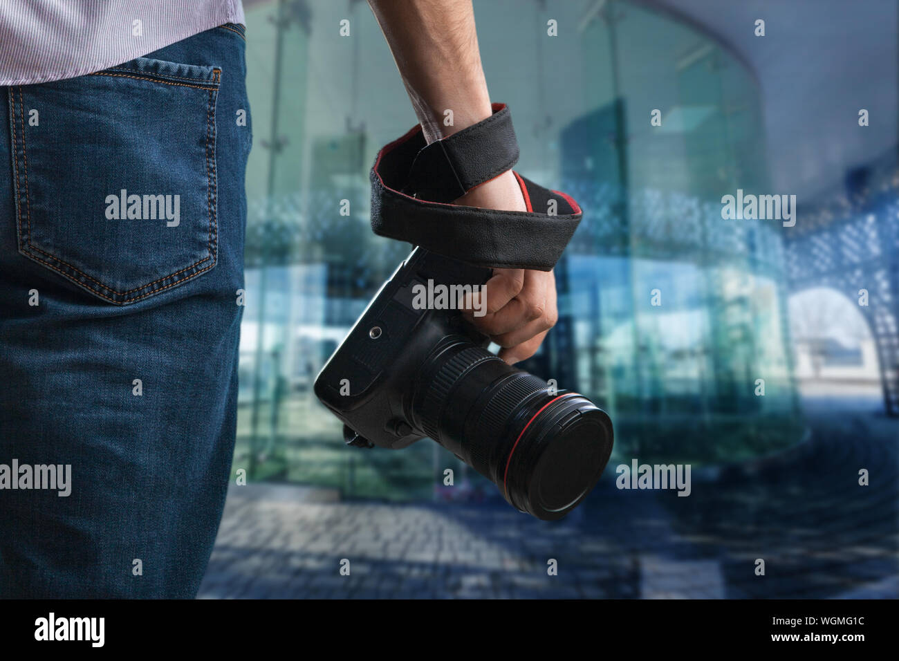 Young black man holds camera hi-res stock photography and images - Alamy